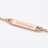 The SkyGiving Signature Charm